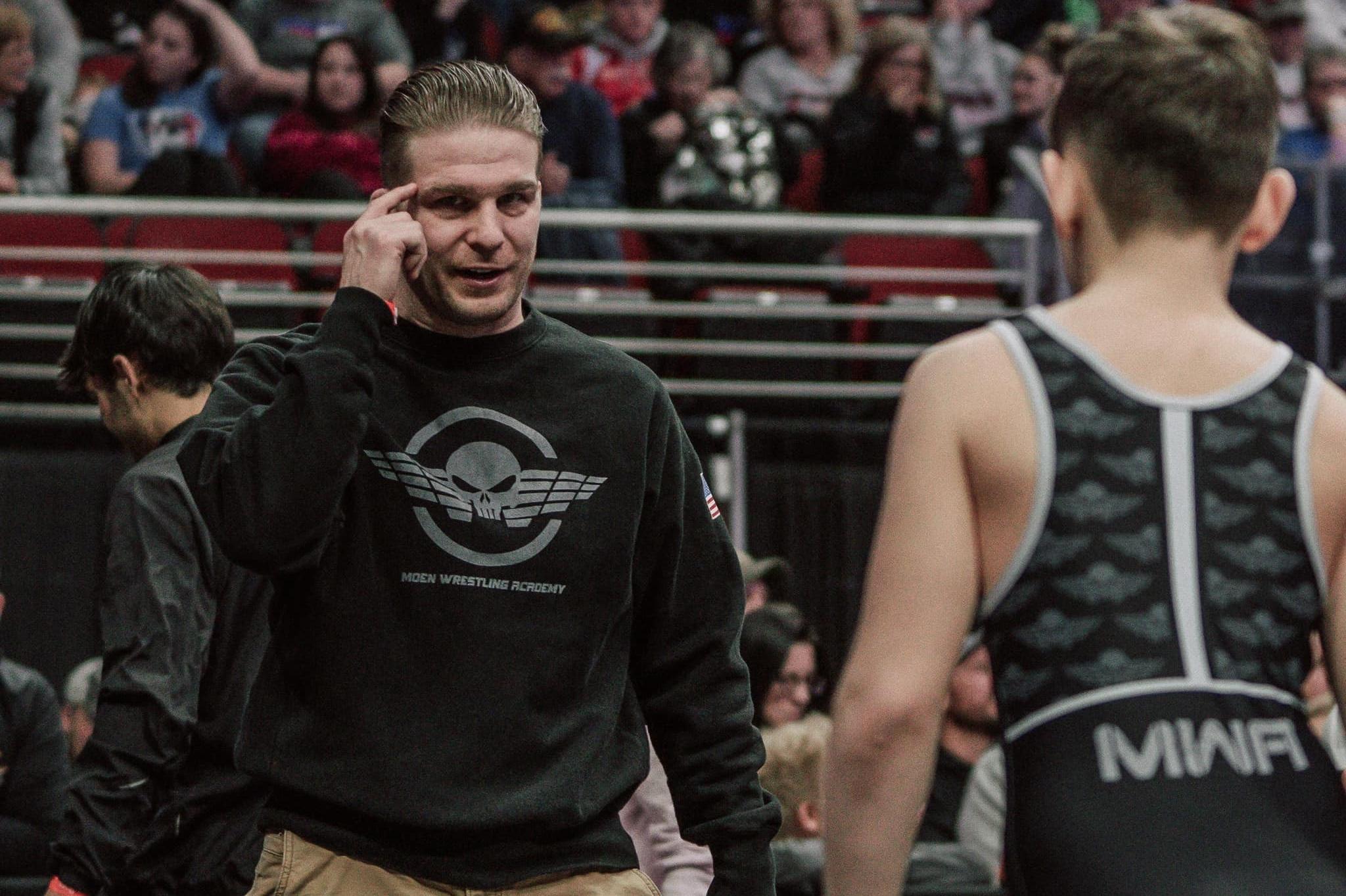 Coach TJ Moen directing an athlete